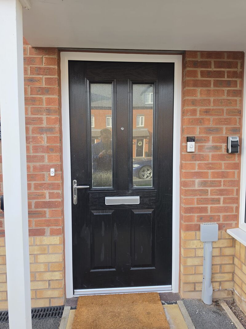 Before: black composite door
