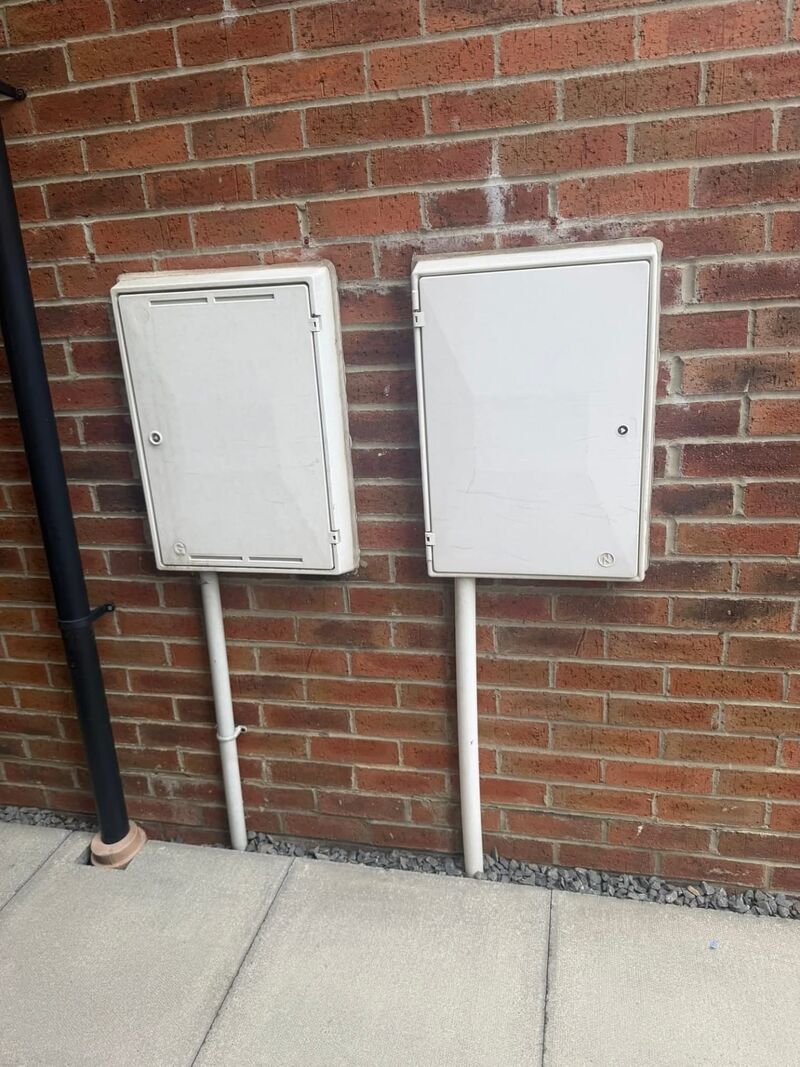 Before: white meter boxes and pipes