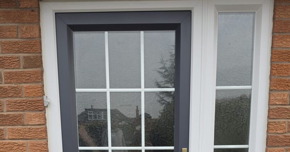 Sprayed uPVC frame and glazing detail in anthracite grey
